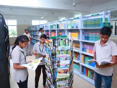 Students referring to journals and books